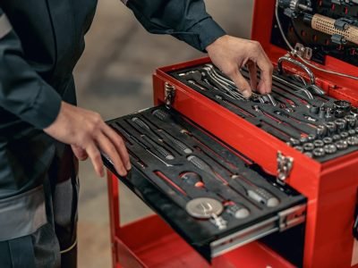 Male Mechanic Using Tool Box In Hangar.jpg