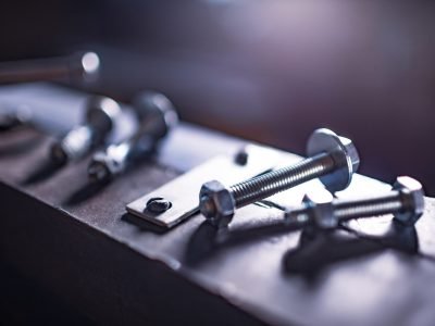 Metal Chrome Bolts And Nuts On Manual Flexible Massive Machine.jpg